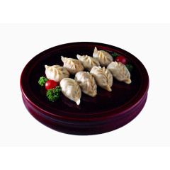 黑色盘子装着的美味饺子