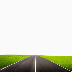 直行的柏油路和绿草地